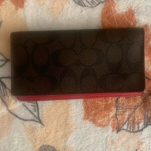 Coach checkbook wallet.